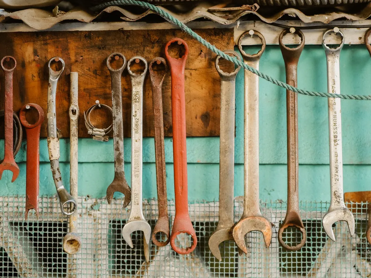 Wrenches hanging on a workshop wall